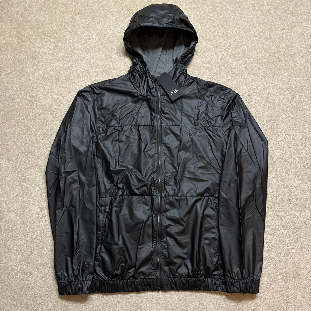 Oakley Explorer Packable‎ Jacket NWT Mens 2XL Black Hooded Windbreaker FOA403077